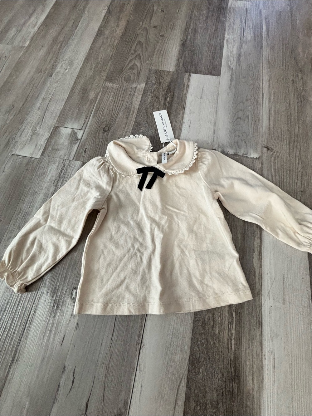 Janie and Jack Cream Long-Sleeve Top with Lace Peter Pan Collar and Black Bow
